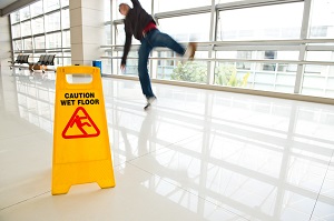 man slipping on wet floor